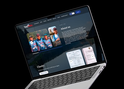 Troutarea about and charity screen shown on a laptop